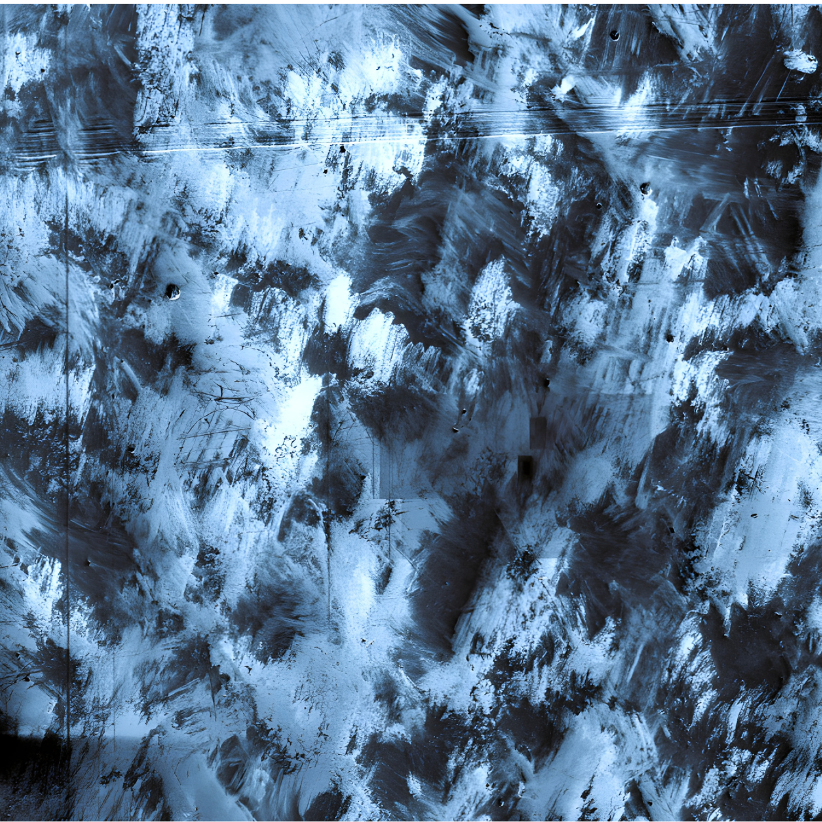 Magnified view of stainless steel surface showing abstract patterns of swirls and scratches from surface defects and contaminants.