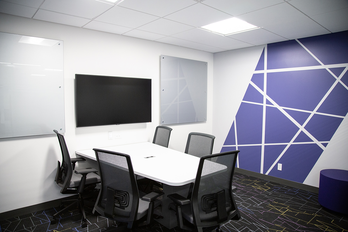 DSC collaboration room 2-20M with two whiteboards and screen.